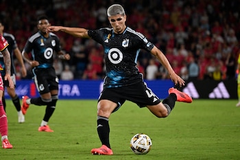 Sep 14, 2024; St. Louis, Missouri, USA; Minnesota United defender Miguel Tapias (4) drives the ball against St. Louis CITY SC in the second half at CITYPARK. Mandatory Credit: Joe Puetz-Imagn Images